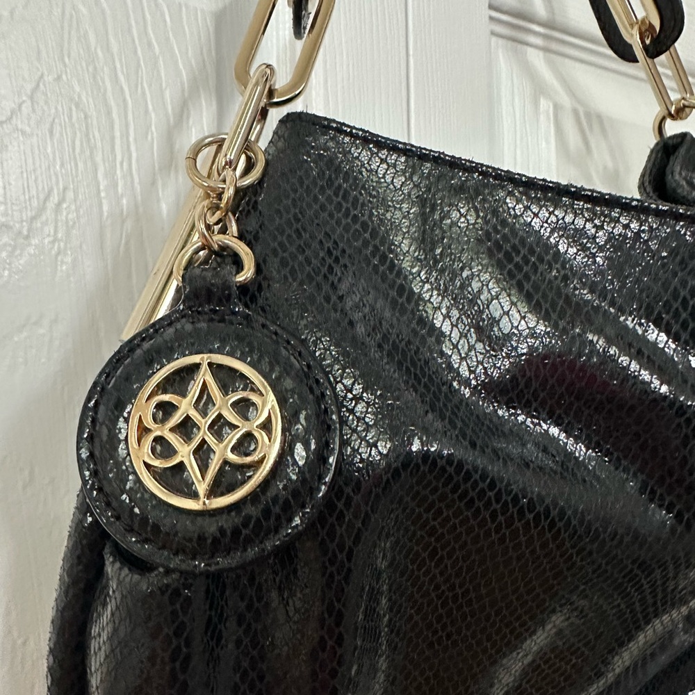 Black snakeskin purse with gold hardware Antonio Melani